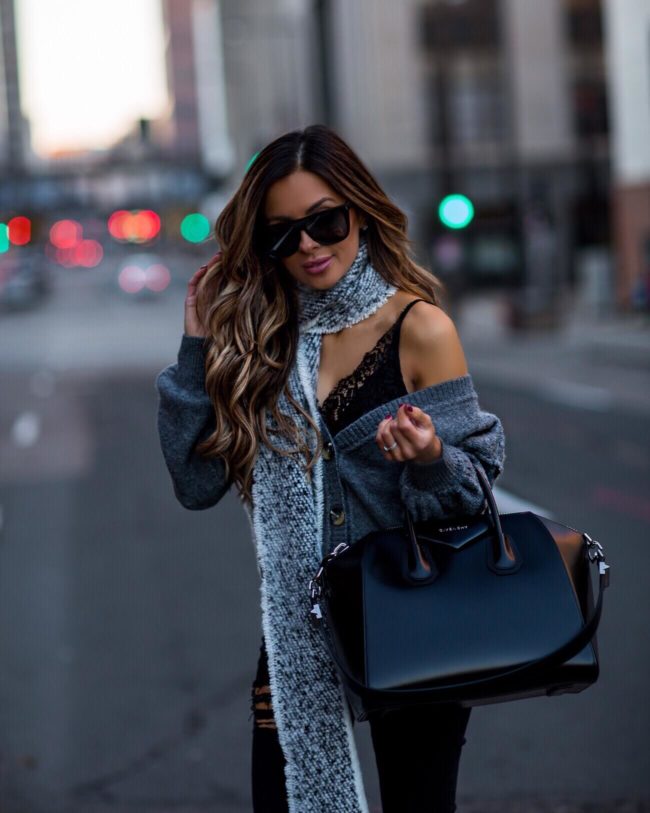 fashion blogger mia mia mine wearing a gray scarf and a givenchy antigona bag
