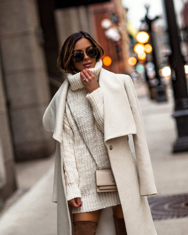 fashion blogger mia mia mine wearing an ivory coat from mango and a chunky white turtleneck sweater