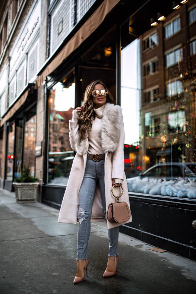 fashion blogger mia mia mine wearing a club monaco pink coat with faux fur trim on sale for black friday 2018