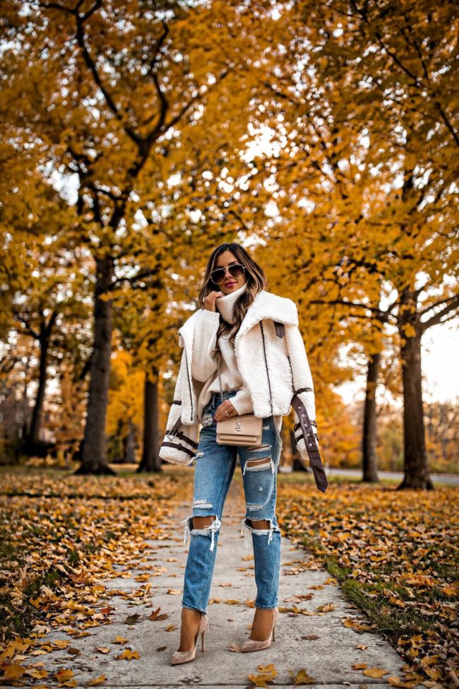 fashion blogger mia mia mine wearing a sherpa jacket from revolve and gianvito rossi suede heels for fall 2018