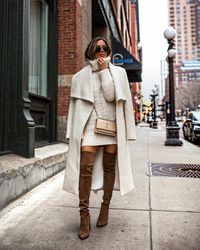 fashion blogger mia mia mine wearing an ivory coat from mango and stuart weitzman over-the-knee boots