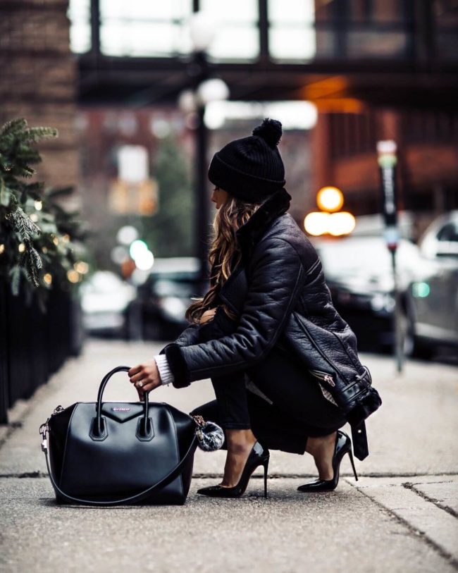 fashion blogger mia mia mine wearing a black H&M biker jacket and a givenchy antigona bag