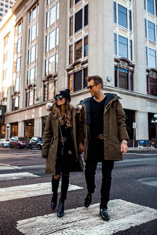 fashion blogger mia mia mine and husband phil thompson wearing gucci belts and canada goose jackets
