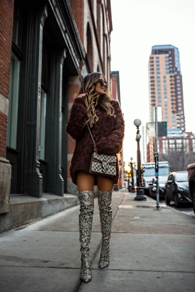 fashion blogger mia mia mine wearing a chunky sweater and mango over-the-knee snakeskin mango boots