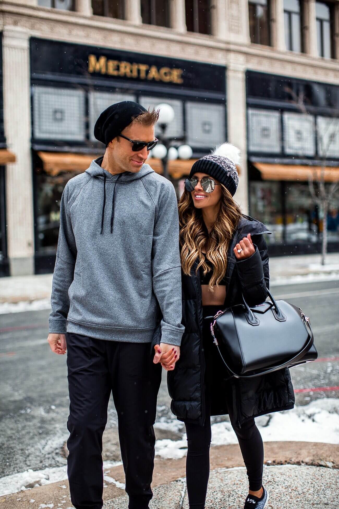 fashion blogger mia mia mine wearing a lululemon outfit with husband phil in the snow