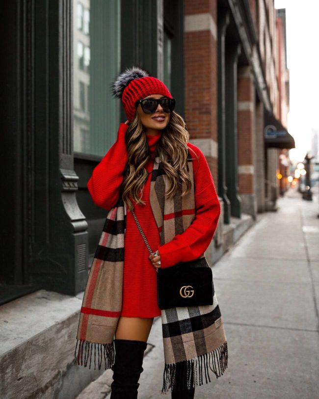 fashion blogger mia mia mine wearing a red sweater dress from revolve and a burberry scarf