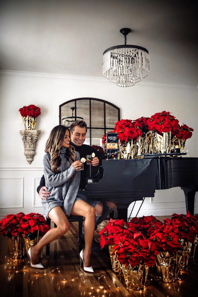 fashion blogger mia mia mine wearing a gray sweater dress from revolve for holiday 2018