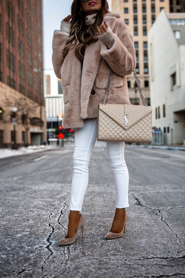 fashion blogger mia mia mine wearing a free people faux fur coat from nordstrom