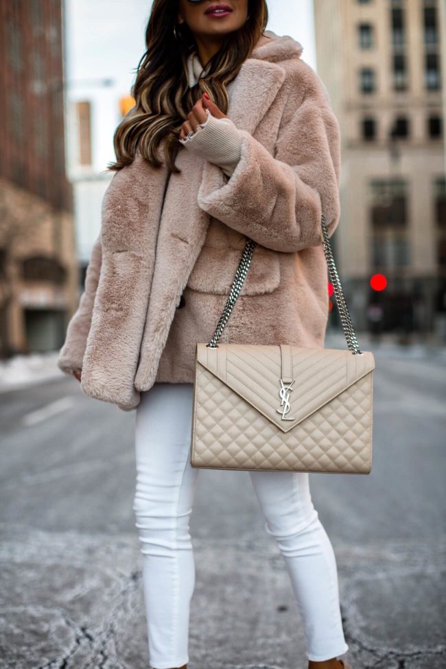 fashion blogger mia mia mine wearing a saint laurent envelope bag