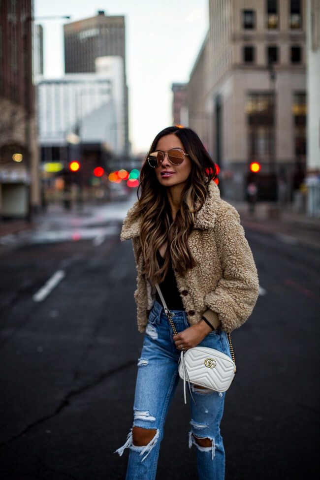 fashion blogger mia mia mine wearing teddy bear jacket from revolve and a gucci marmont bag