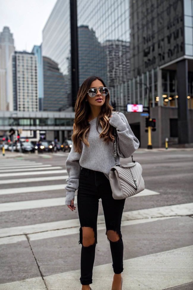fashion blogger mia mia mine wearing a saint laurent college large grey bag and an intermix sweater