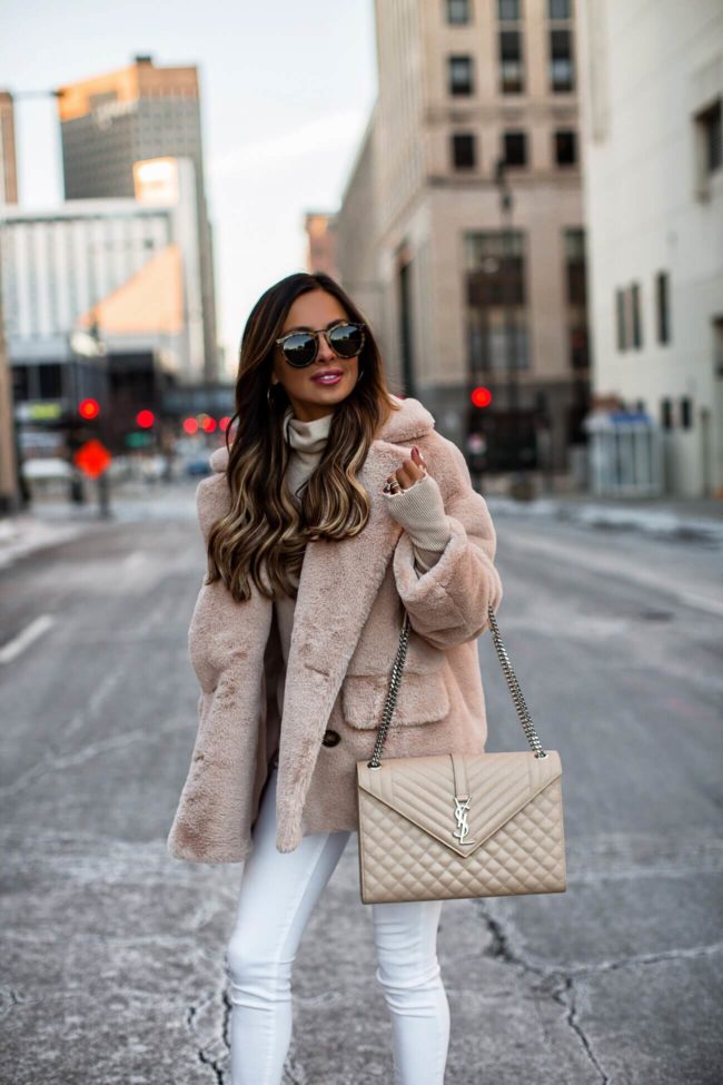fashion blogger mia mia mine wearing a pink faux fur teddy coat from nordstrom