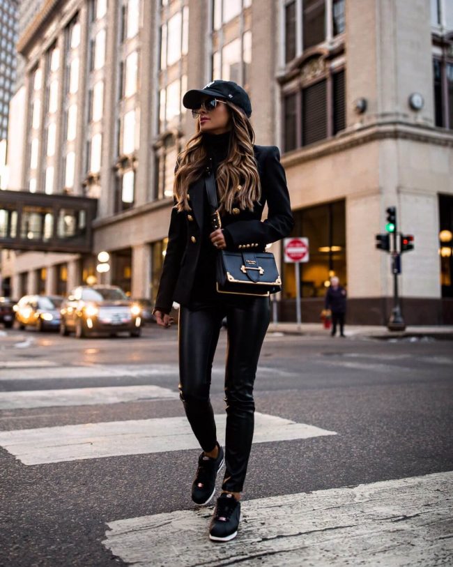 fashion blogger mia mia mine wearing a balmain blazer and nike sneakers