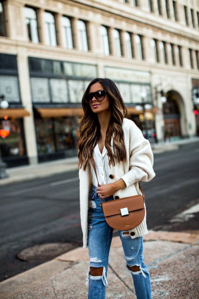 fashion blogger mia mia mine wearing celine sunglasses and a demellier bag