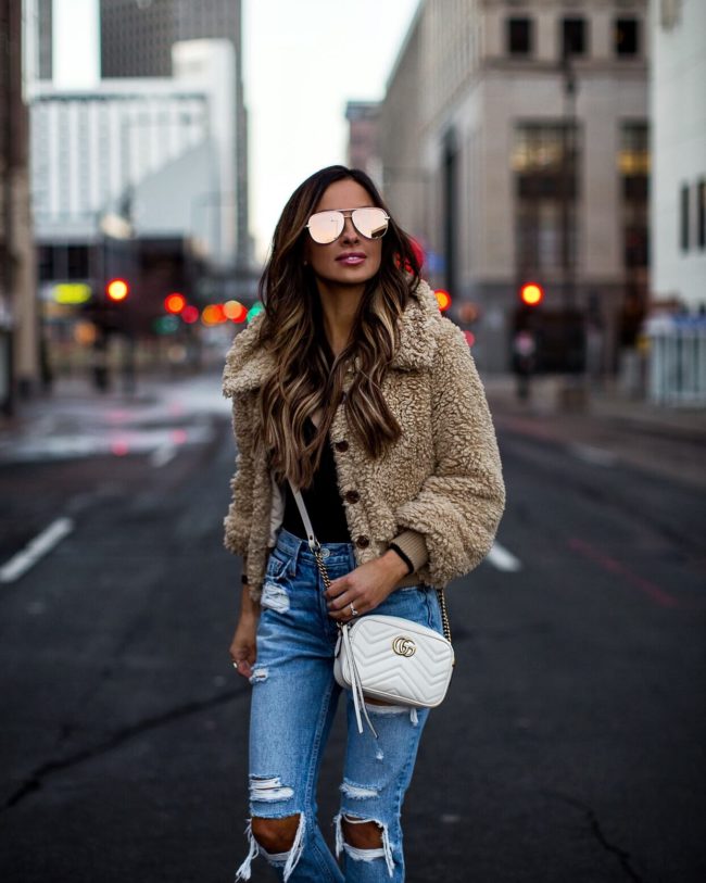 fashion blogger mia mia mine wearing a teddy bear coat from revolve