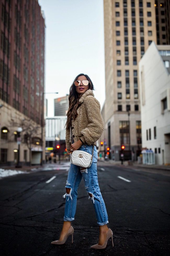 fashion blogger mia mia mine wearing a teddy bear coat from revolve 2019