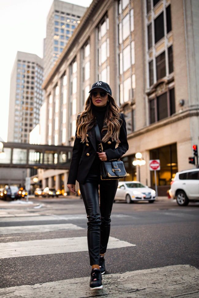 fashion blogger mia mia mine wearing a balmain blazer and a prada cahier bag
