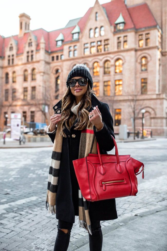 fashion blogger mia mia mine wearing a burberry plaid scarf and a black beanie