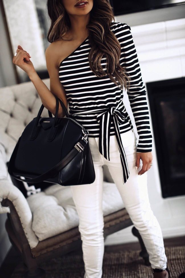 fashion blogger mia mia mine wearing a striped top and a givenchy bag
