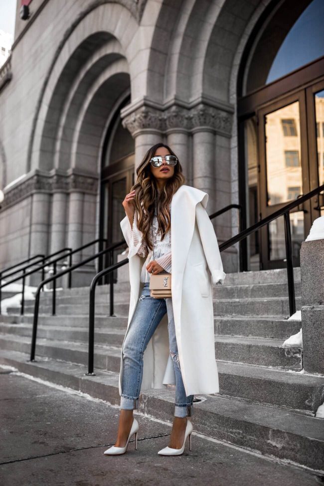 fashion blogger mia mia mine wearing white christian louboutin heels and a saint laurent sunset handbag