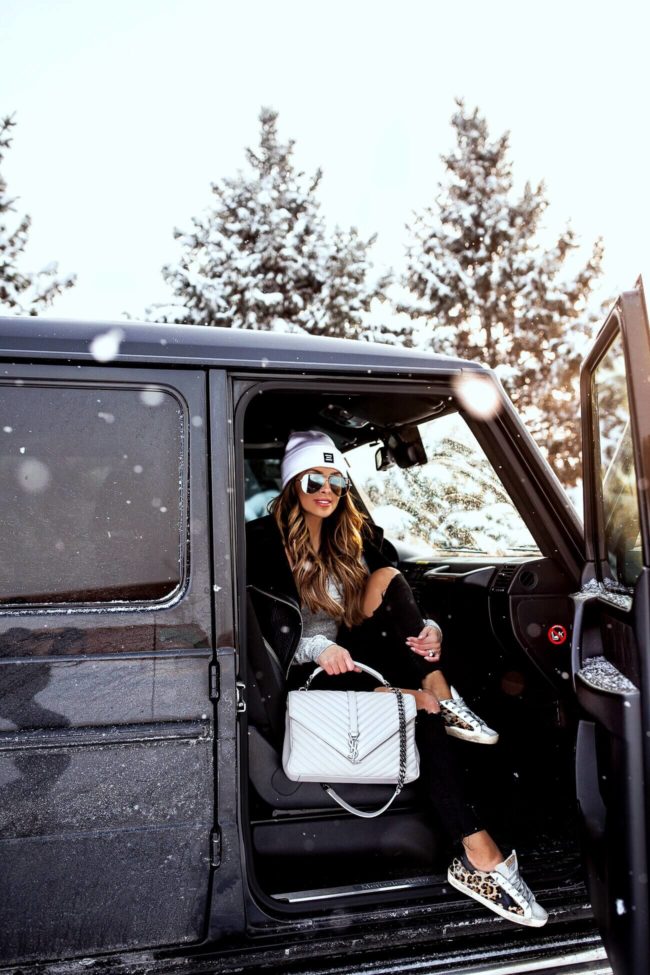 fashion blogger mia mia mine wearing golden goose sneakers with a saint laurent college bag