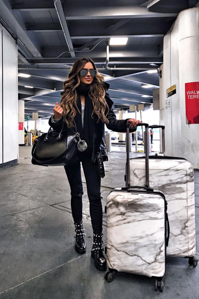 fashion blogger mia mia mine using calpak marble luggage to travel