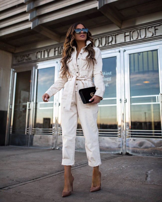 fashion blogger mia mia mine wearing a white jumpsuit from topshop at nordstrom for spring 2019