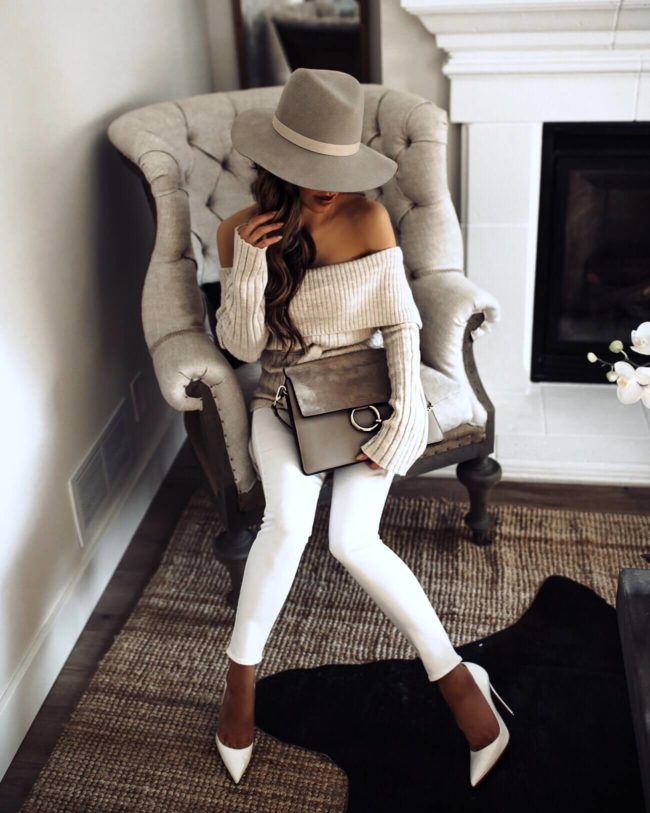 fashion blogger mia mia mine wearing a janessa leone hat and an asos off-the-shoulder sweater for winter
