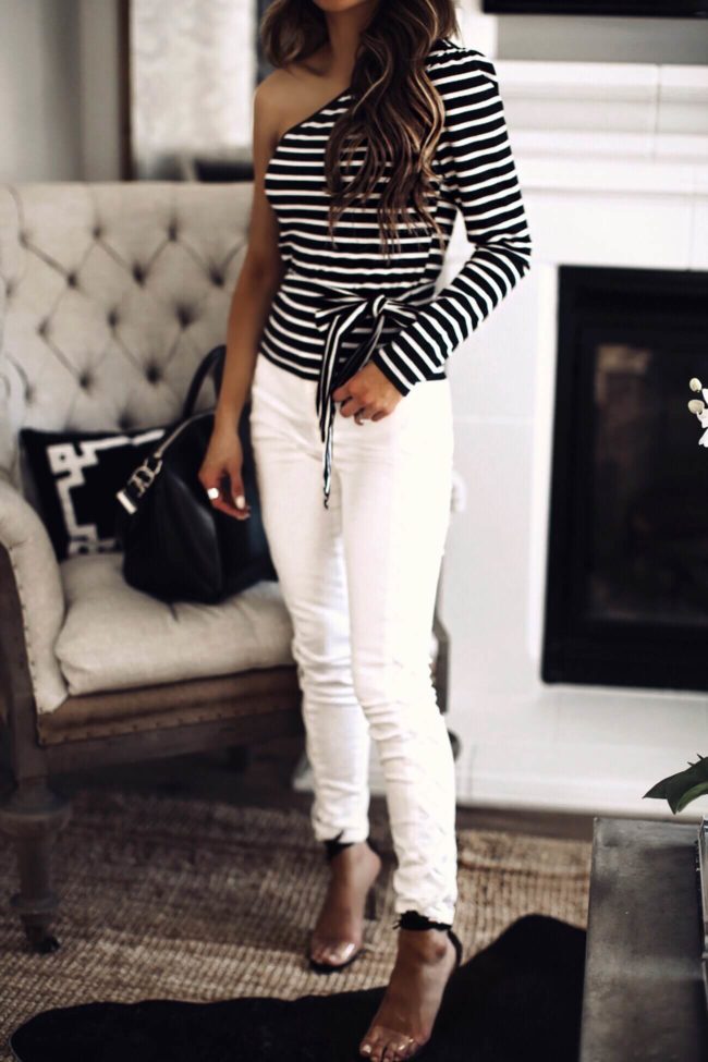 fashion blogger mia mia mine wearing a striped top and white denim from walmart