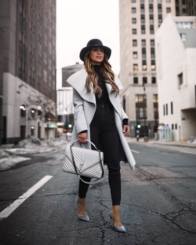 fashion blogger mia mia mine wearing a gray coat and a saint laurent handbag