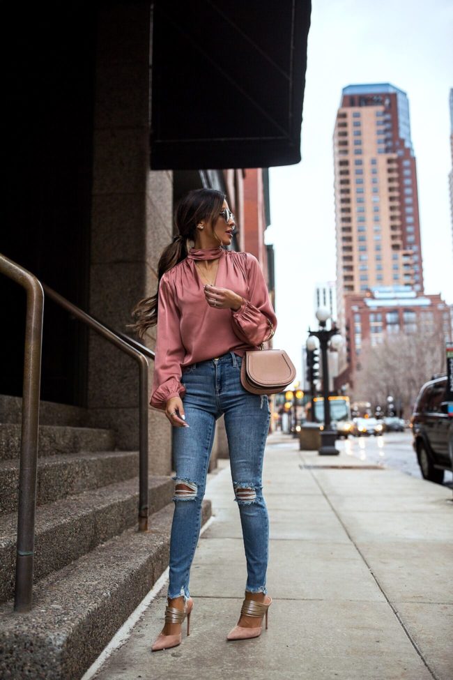 fashion blogger mia mia mine wearing a pink blouse from intermix and frame denim