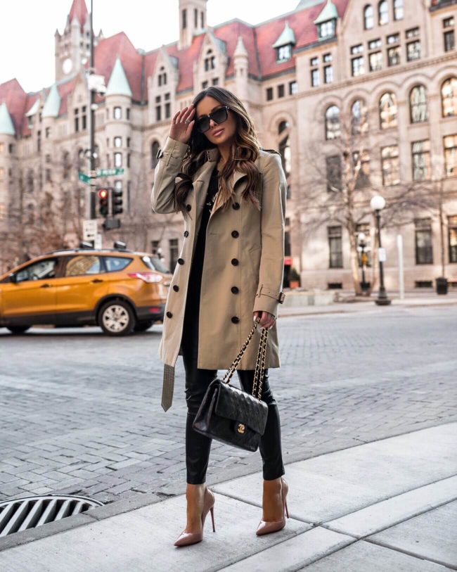 fashion blogger mia mia mine wearing a burberry trench coat and a chanel bag
