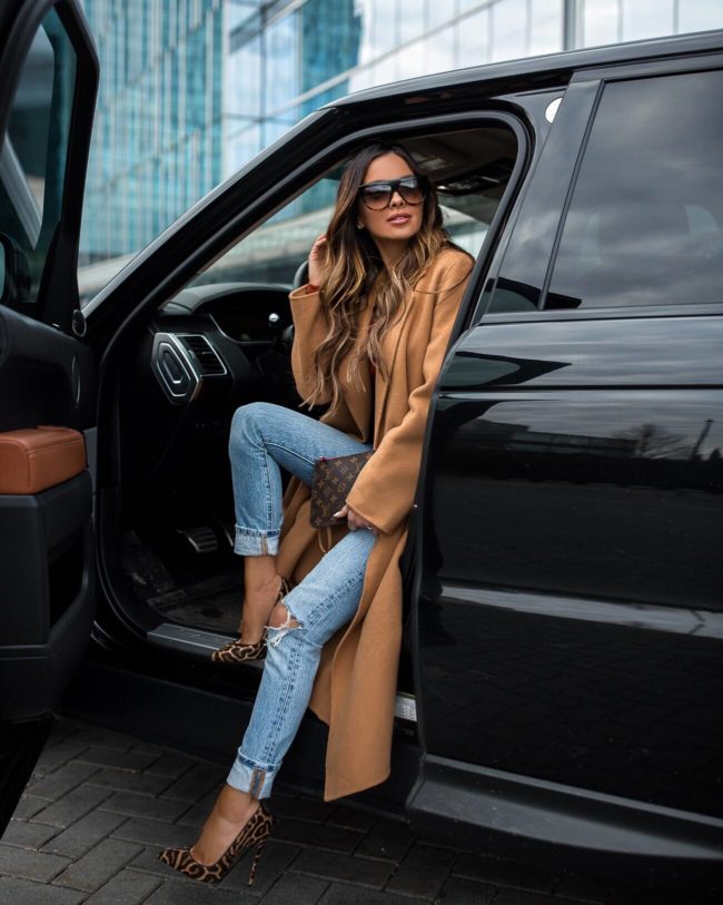 fashion blogger mia mia mine wearing a camel coat and leopard heels