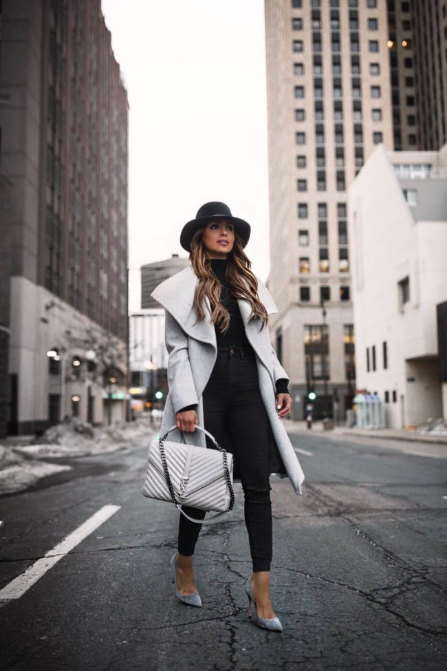 fashion blogger mia mia mine wearing a gray coat and a saint laurent handbag