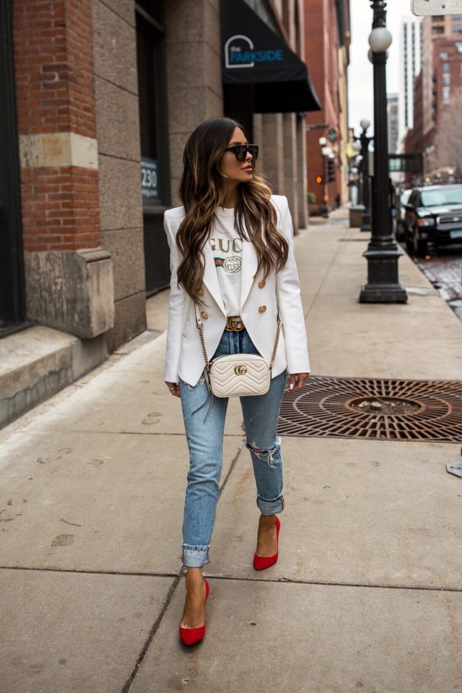 fashion blogger mia mia mine wearing a balmain blazer and a gucci marmont white bag
