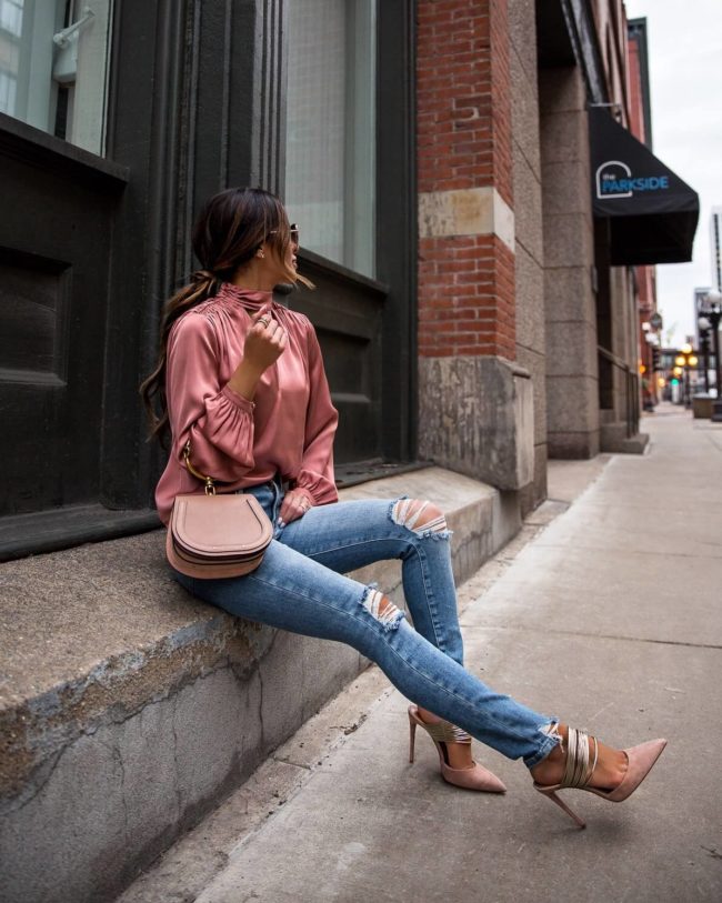 fashion blogger mia mia mine wearing a pink rose blouse from intermix