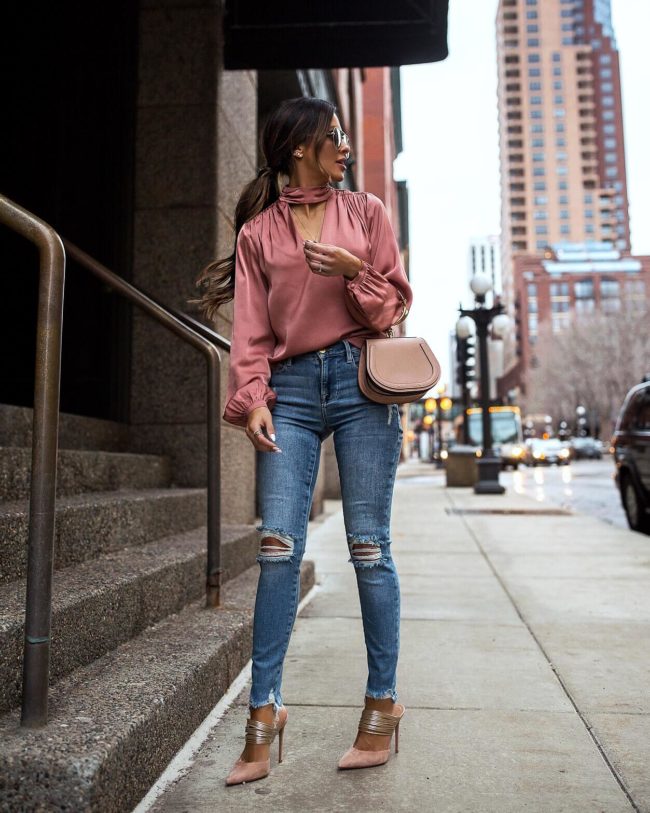 fashion blogger mia mia mine wearing a pink blouse from intermix and frame denim