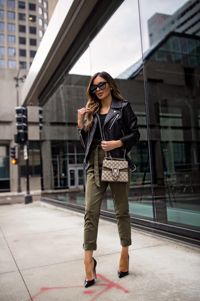 fashion blogger mia mia mine wearing khaki pants from revolve and a leather jacket for spring 2019