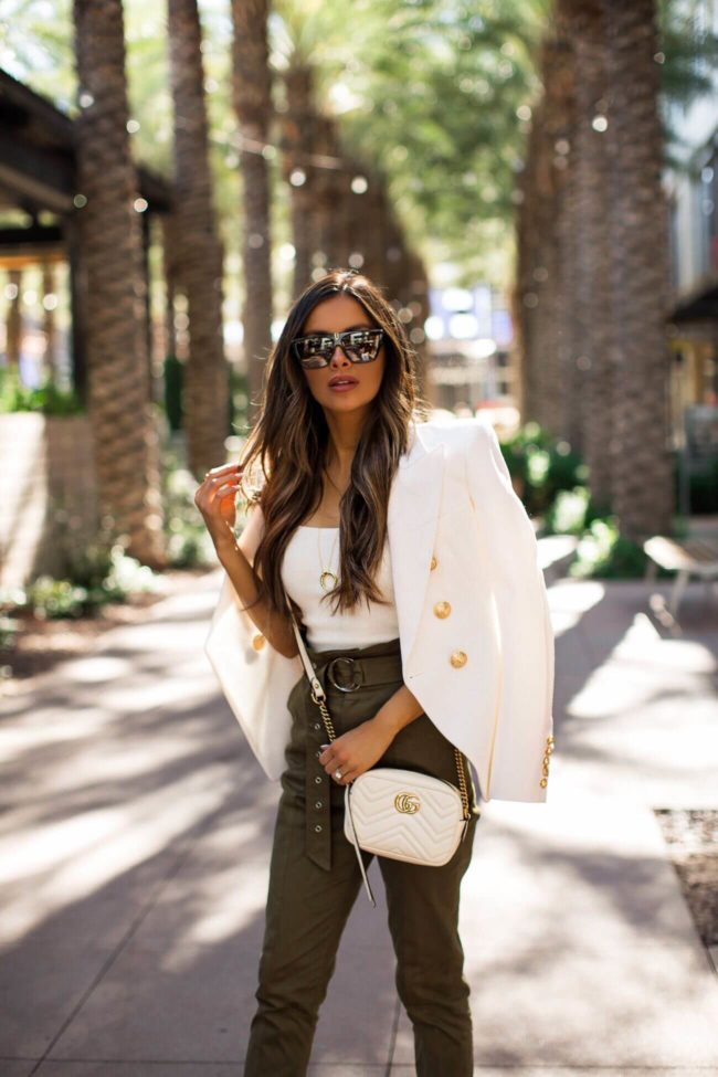 fashion blogger mia mia mine wearing a white balmain blazer and a gucci marmont bag