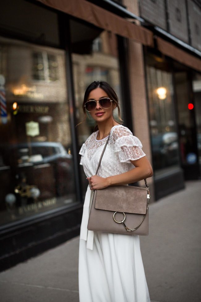 fashion blogger mia mia mine wearing a white lace top from walmart
