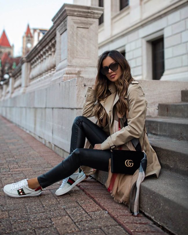 fashion blogger mia mia mine wearing a burberry trench and gucci sneakers