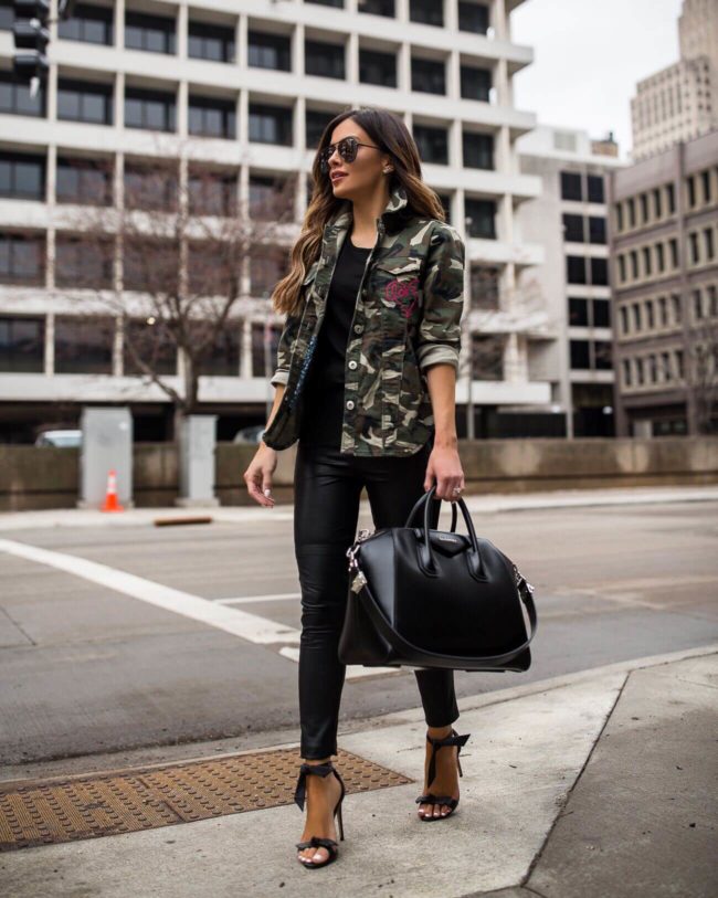 fashion blogger mia mia mine wearing a camo jacket from walmart and leather leggings
