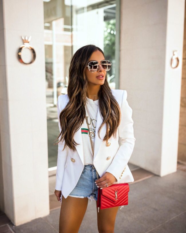 fashion blogger mia mia mine wearing a gucci tee and a white balmain blazer