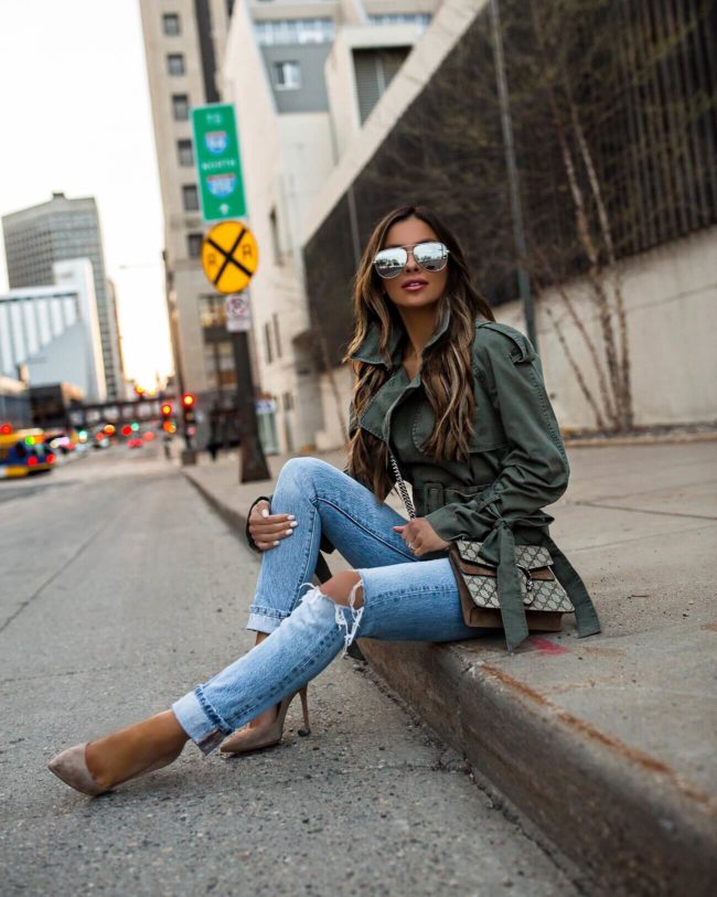 fashion blogger mia mia mine wearing an anine bing trench coat and levi's denim