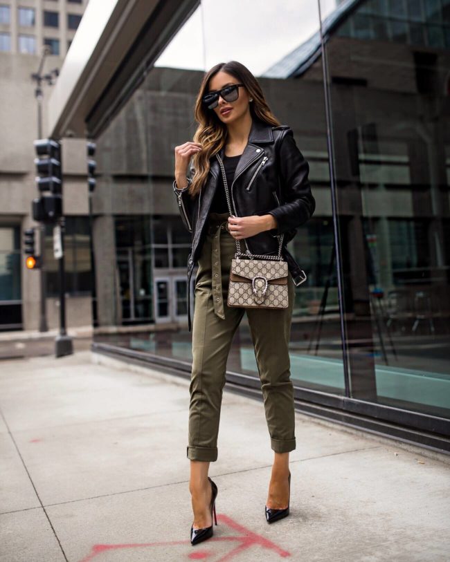 fashion blogger mia mia mine wearing khaki pants from revolve and a leather jacket for spring 2019