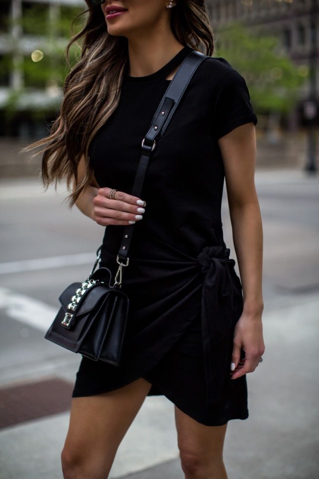 fashion blogger mia mia mine wearing a valentino bag and saks off fifth knit black dress