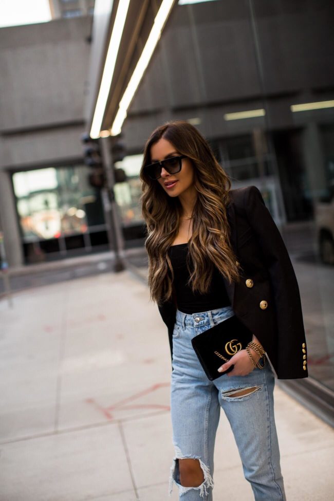 fashion blogger mia mia mine wearing a balmain blazer and black bodysuit from nordstrom