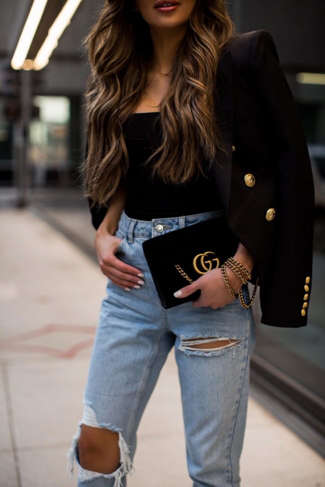 fashion blogger mia mia mine wearing a gucci bag and topshop denim