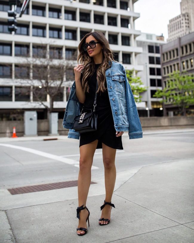 fashion blogger mia mia mine wearing a denim jacket and a saks off fifth dress