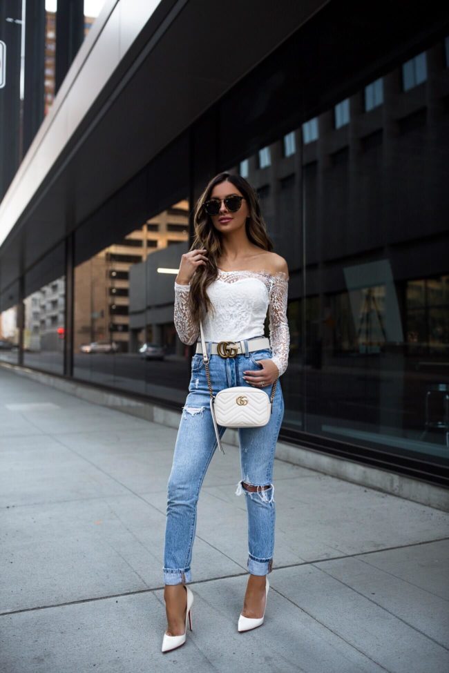 fashion blogger mia mia mine wearing levi's jeans and white christian louboutin heels